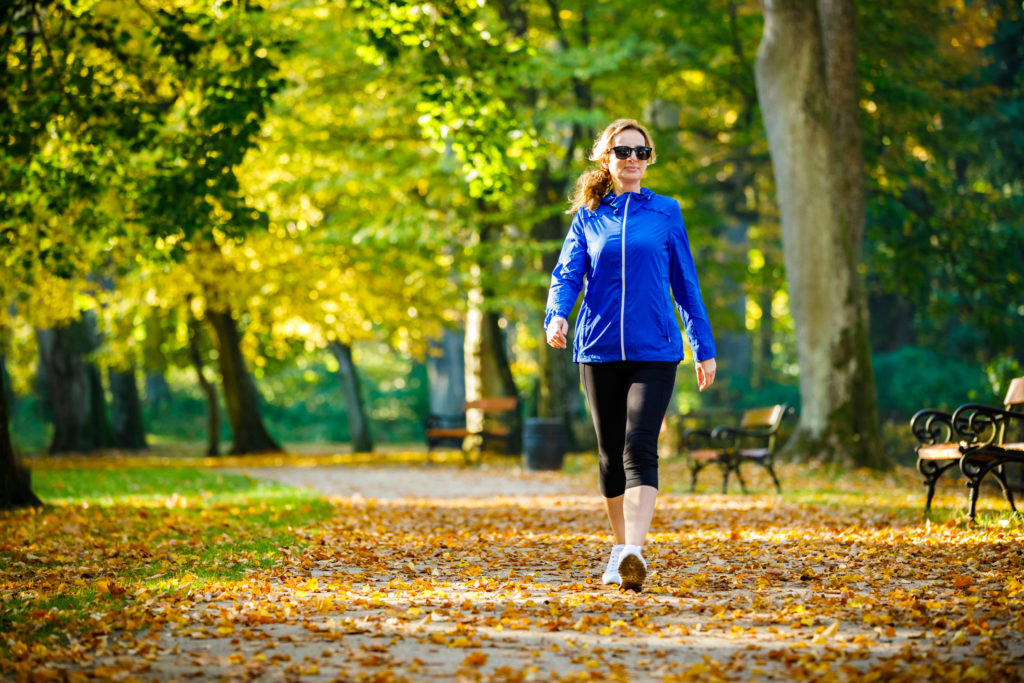 Woman walking in a park